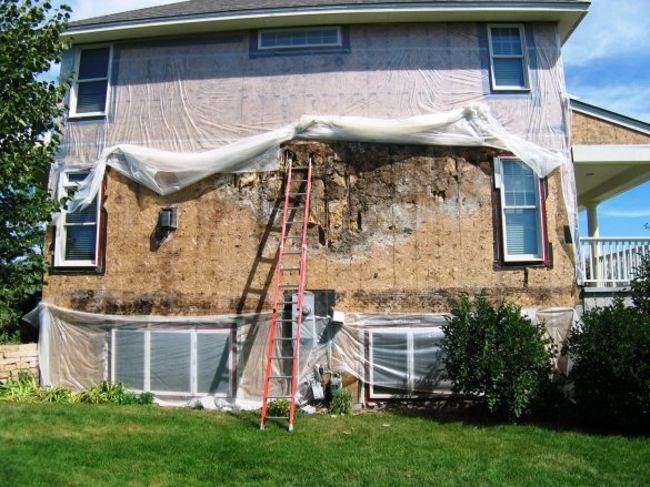 View of the wall frame house after dismantling the siding. Minnesota, USA.