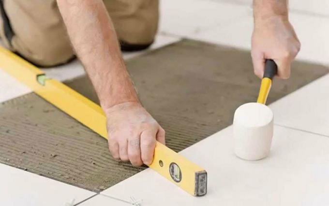 Use a level and a rubber mallet when installing tiles
