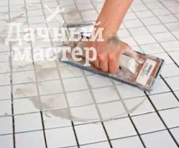 Grouting tiles with their hands