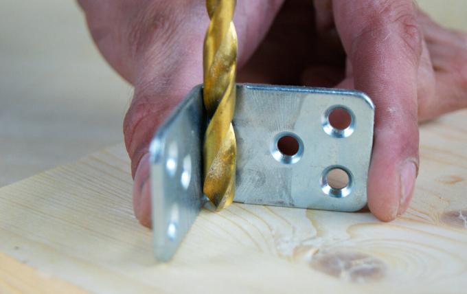 drill a hole at right angles using a metal bracket