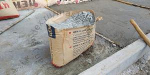 How fast and dust-split in half a bag of cement. Useful trick.