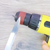 Sharpening a knife by means of screwdriver.